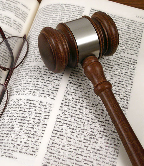Gavel and Glasses on Book